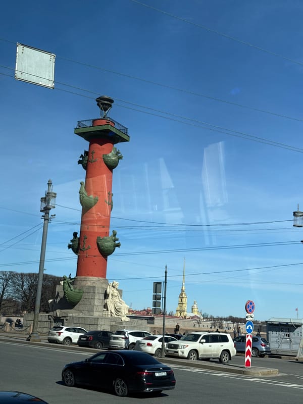 Rostral Column photographed from vehicle in Saint Petersburg
