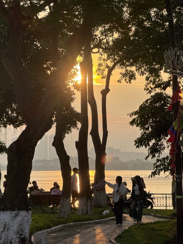 West Lake at golden hour, Hanoi streets and landmarks nearby