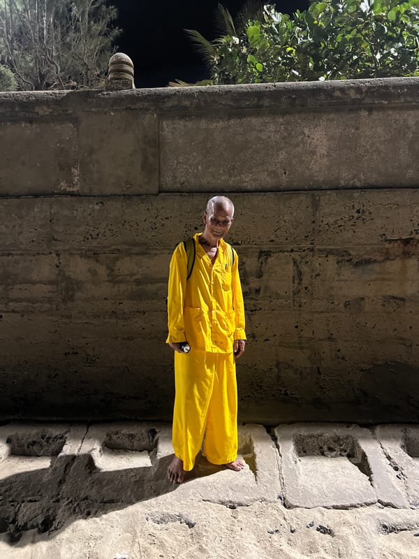 Elderly man in yellow jumpsuit photographed in Nha Trang