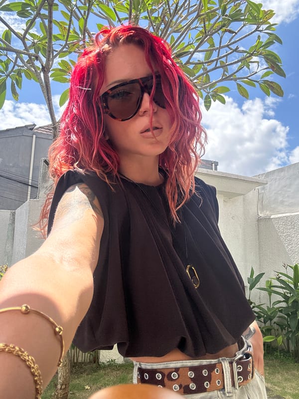 Woman takes selfies in North Kuta, Indonesia early morning
