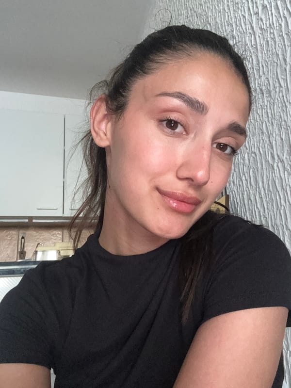 Woman photographed in kitchen setting in Miljevci, Montenegro