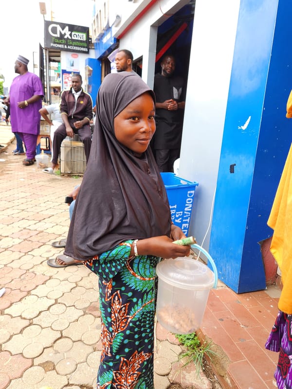Street vendors and delivery workers observed during midday commerce