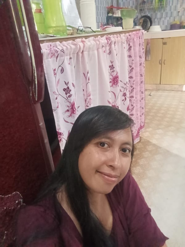Woman takes multiple selfies in Baron Indonesia kitchen