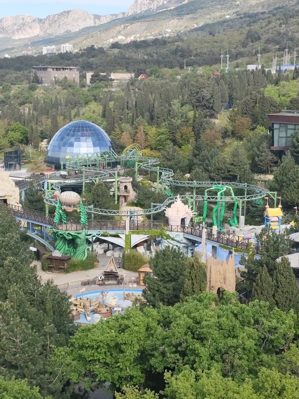 Aerial views document amusement park in mountainous Ukrainian settlement