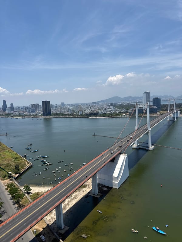 Tourist documents morning hotel stay with bridge views in Đà Nẵng