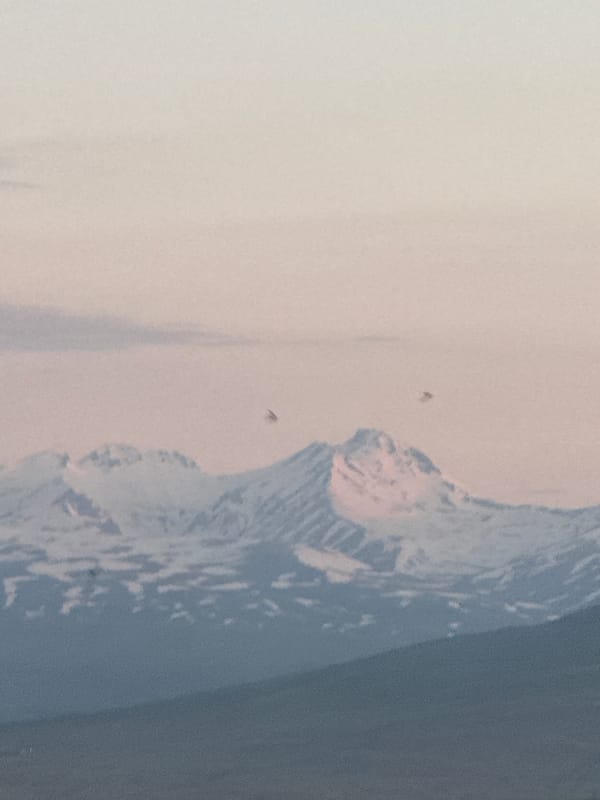 Dawn cityscape documented in Abovyan, Armenia with snow-capped mountains