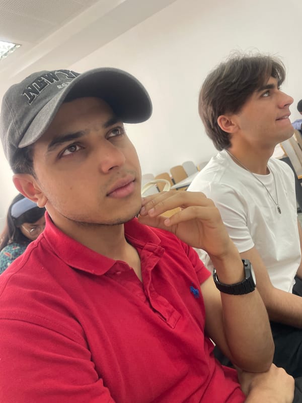 Two young men gather indoors in Beijing suburb