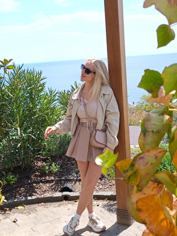 Woman in beige documented near Orthodox church, gazebo locations