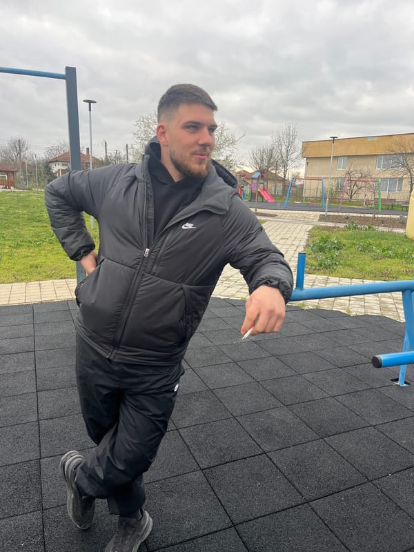 Man smokes cigarette at outdoor exercise area in Bulgaria