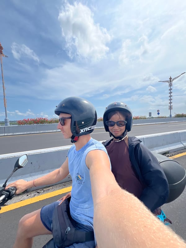 Motorcycle riders cross bridge in Nusa Dua, Indonesia