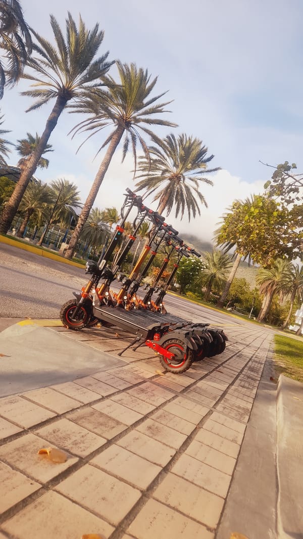 Scooter rental spot at dusk, Pedro González waterfront