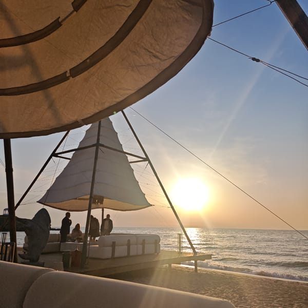 Beachgoers gather under canopy at Shcholkino resort area