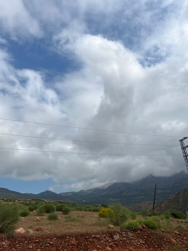 Workers service power lines in rural Morocco landscape