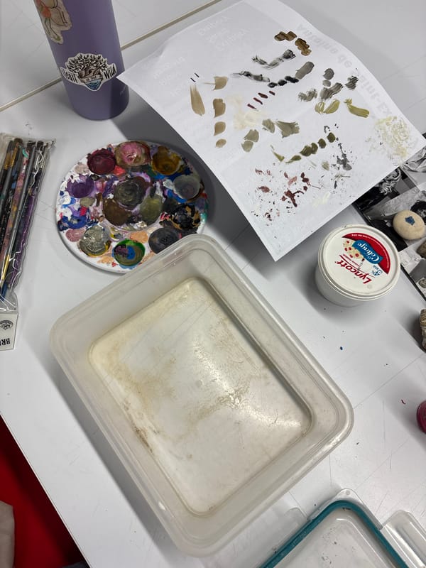 Artist workspace with paints and mineral collection documented Mexico City