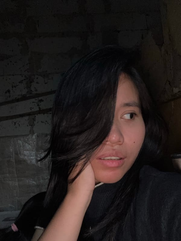 Solo selfie session in a dimly lit East Jakarta room