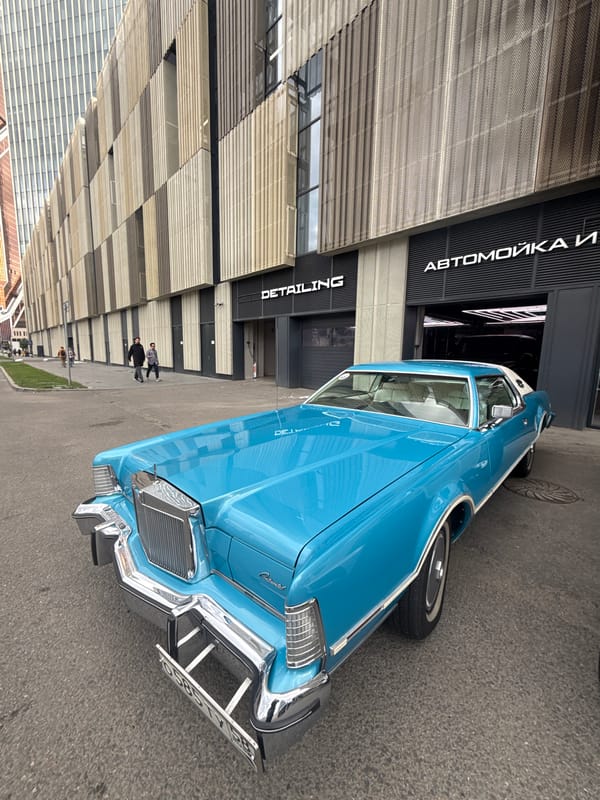 Classic American Lincoln Continental parked outside Moscow detailing shop