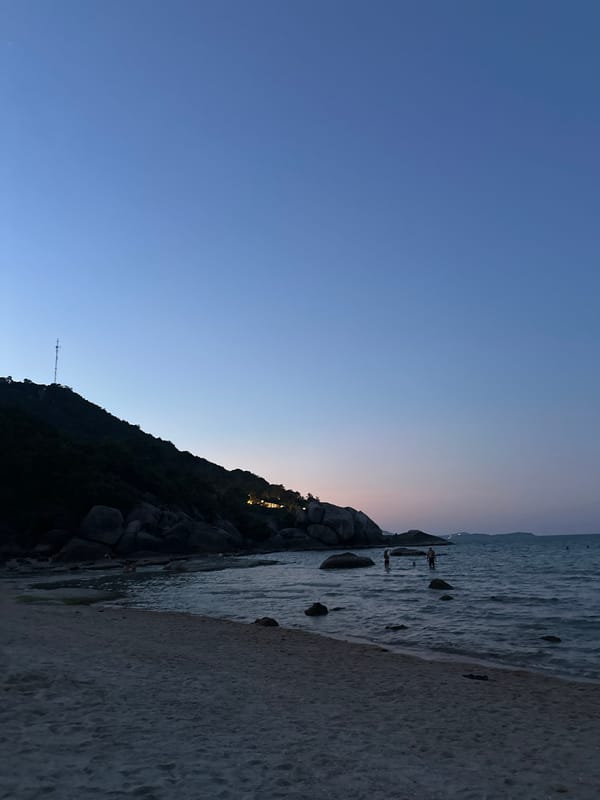 Twilight beach moment with watermelon snack in Thailand