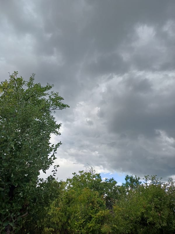 Storm clouds building over rural Sulymivka on a summer afternoon