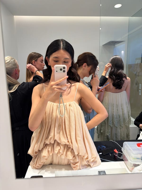 Woman takes backstage selfie in crowded Ramatuelle dressing room