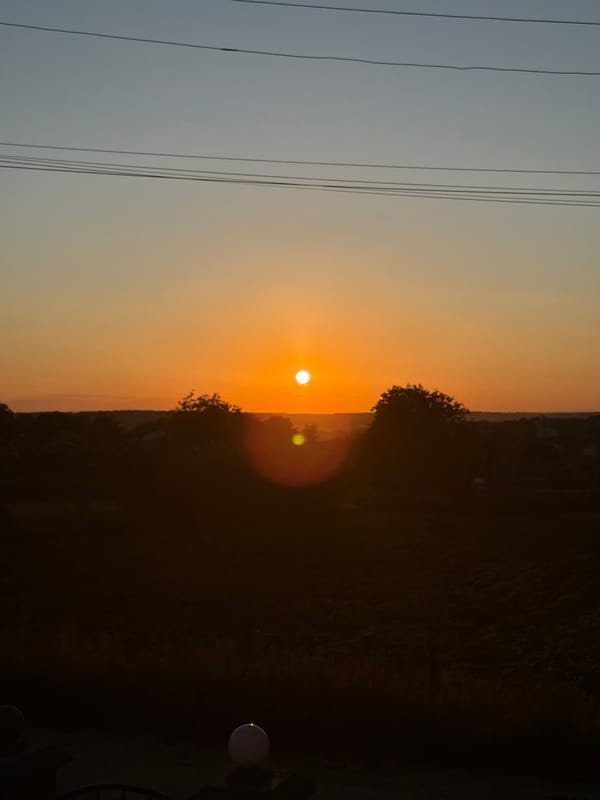 Rural sunset viewed from indoors and out