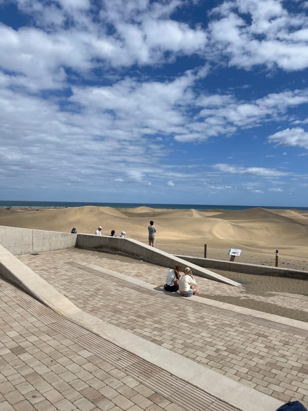 Visitors gather at coastal viewing area in Gran Canaria