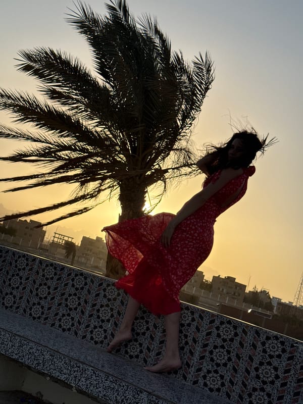 Woman poses for photos during golden hour in Safaga