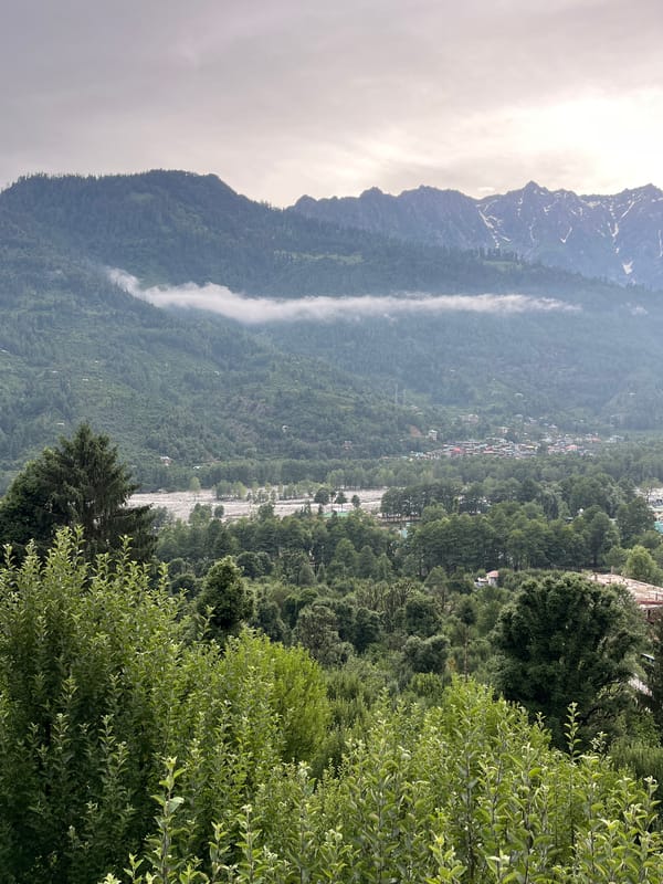 Cloudy afternoon views across Vashisht valley and the Himalayas