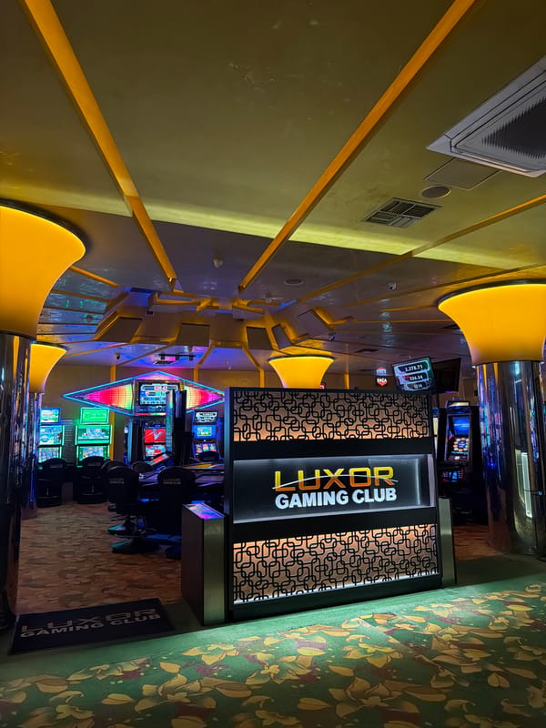 Gaming club interior captured with illuminated displays and machines