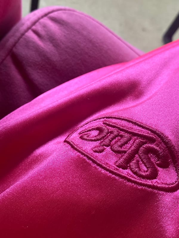 Gray cat photographed on pink fabric in Votkinsk