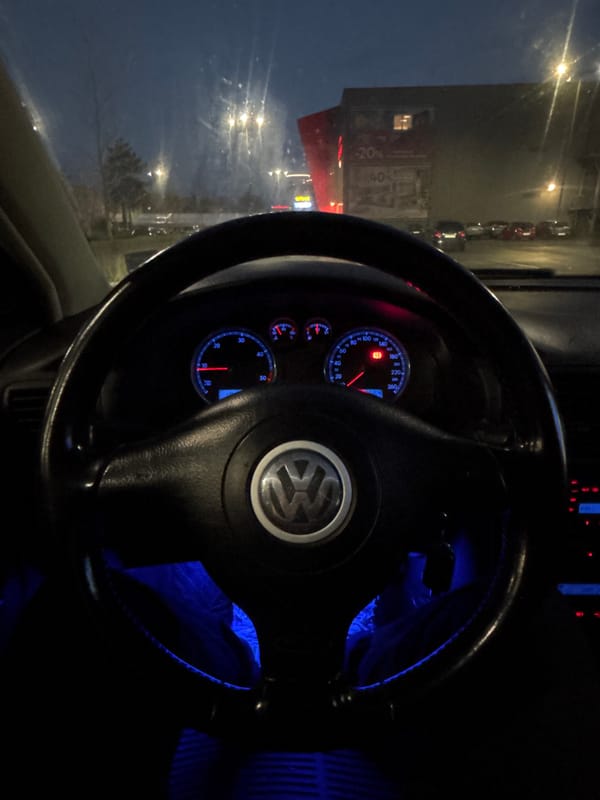 Evening routine documented in Burgas: driving, wet streets, cat