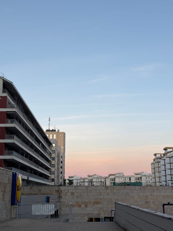 Dusk cityscape photographed in Lisbon showing modern buildings against twilight sky