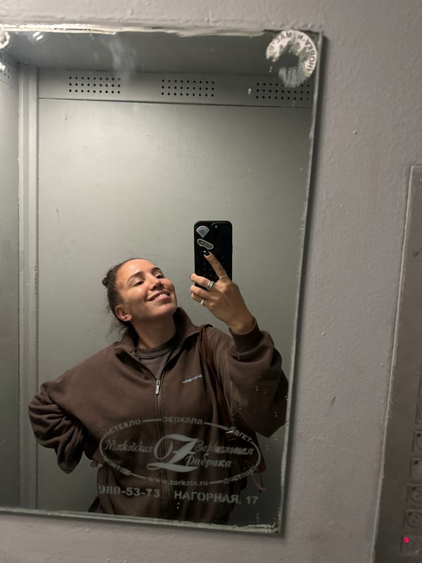 Woman takes selfie in branded mirror in Moscow