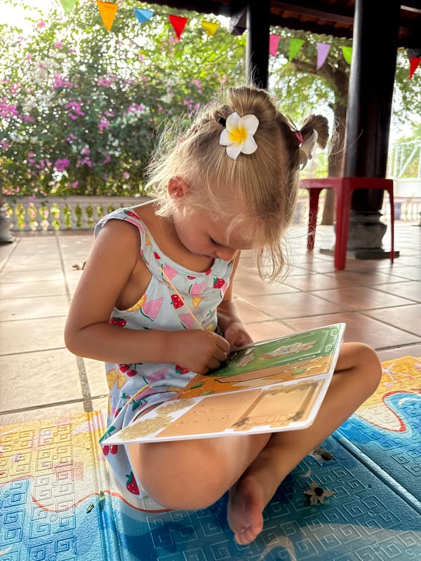 Children's reading and play time captured in Mũi Né