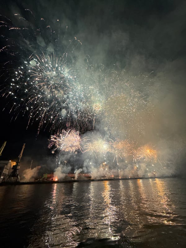 Colorful fireworks light up Ventspils harbor at night