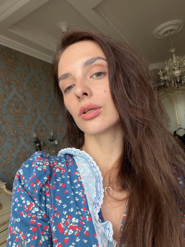 Selfie in Ufa featuring a floral dress and gold crescent necklace