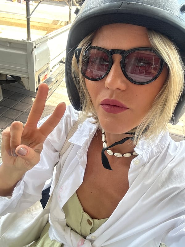 Tourist takes selfie amid North Kuta street scenes