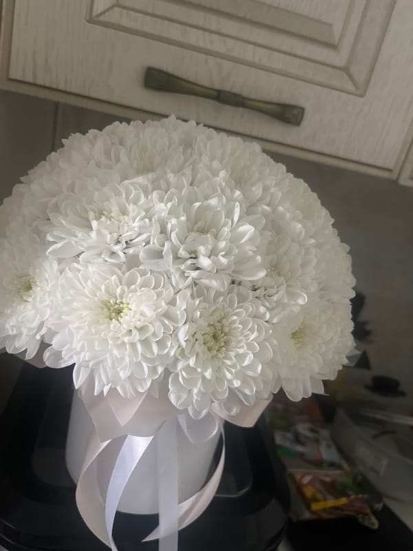White chrysanthemum bouquets and animal art in Tyumen