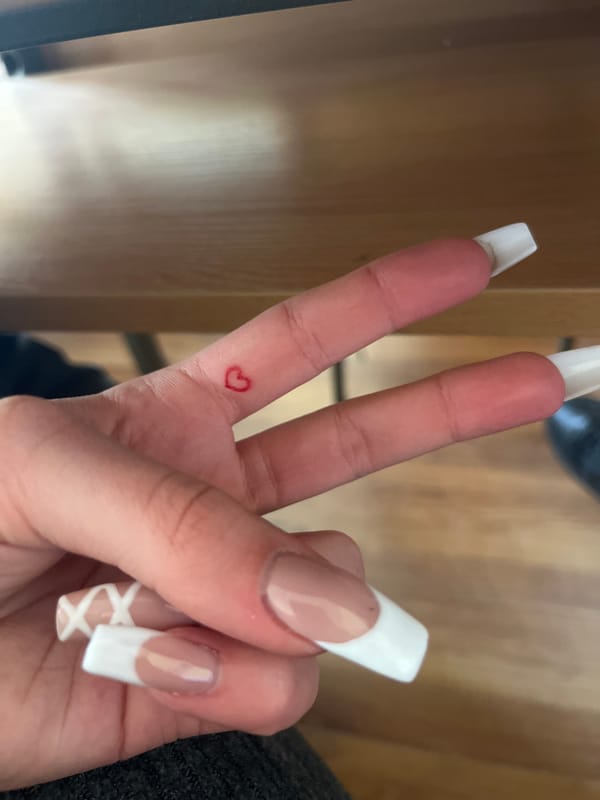 Student's elaborate manicure documented during Bulgarian classroom session