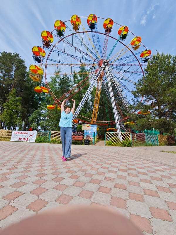 Mother and child enjoy morning at Chaikovsky fairground