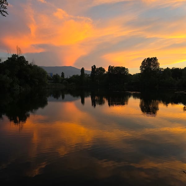 Warm sunset over still water outside Sofia