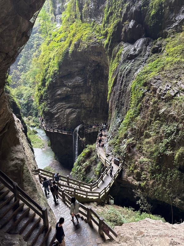 Tourists explore waterfalls and caves in Wulong District, China