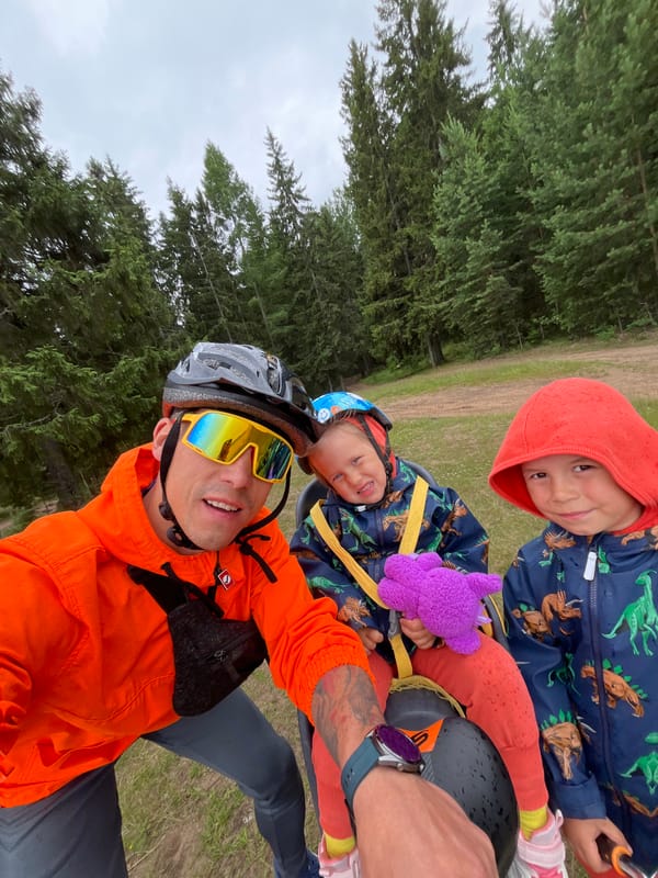 Family bike ride through Chaikovsky forests on a grey afternoon