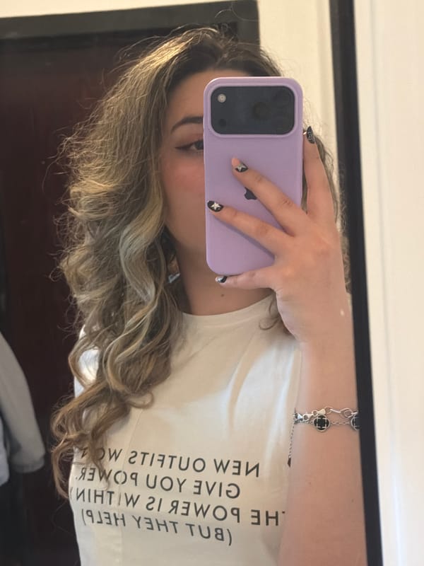 Person takes mirror selfie with lavender phone in Plovdiv