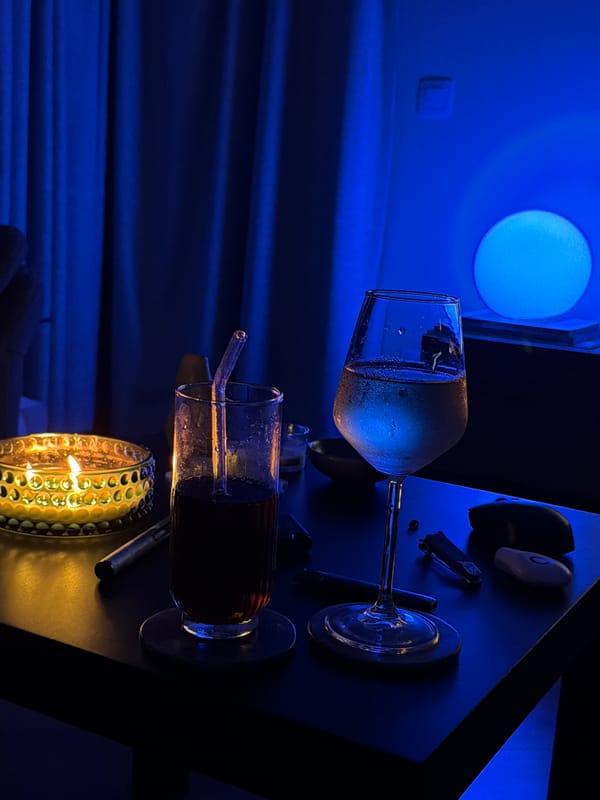 Golden candle glows in dimly lit Sofia interior