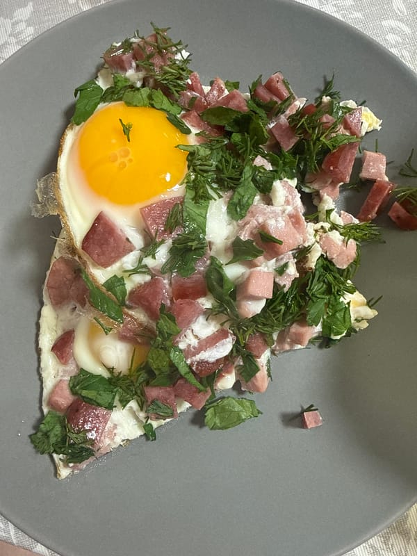 Breakfast meal documented with eggs and salad at dawn