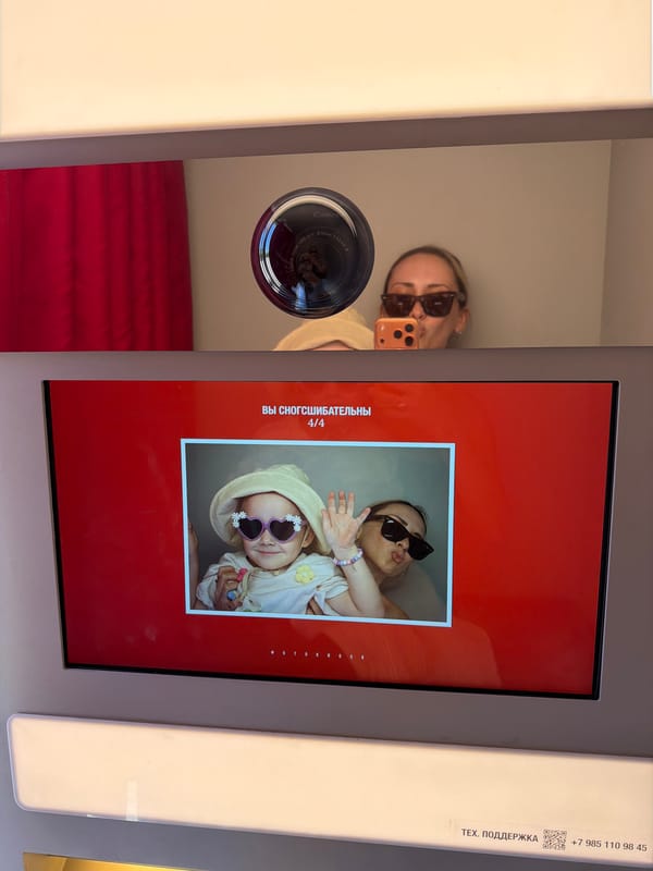 Mother and child enjoy photo booth at Khimki public event