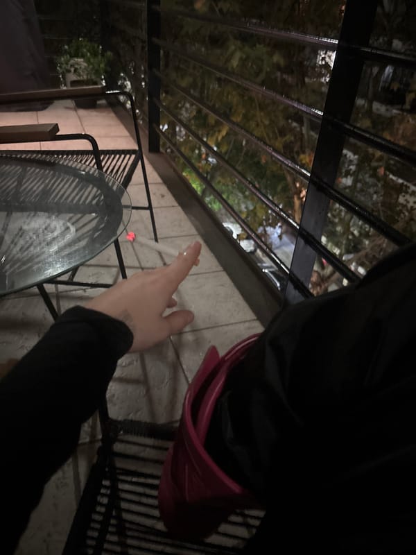 Early morning smoking break observed on Buenos Aires balcony