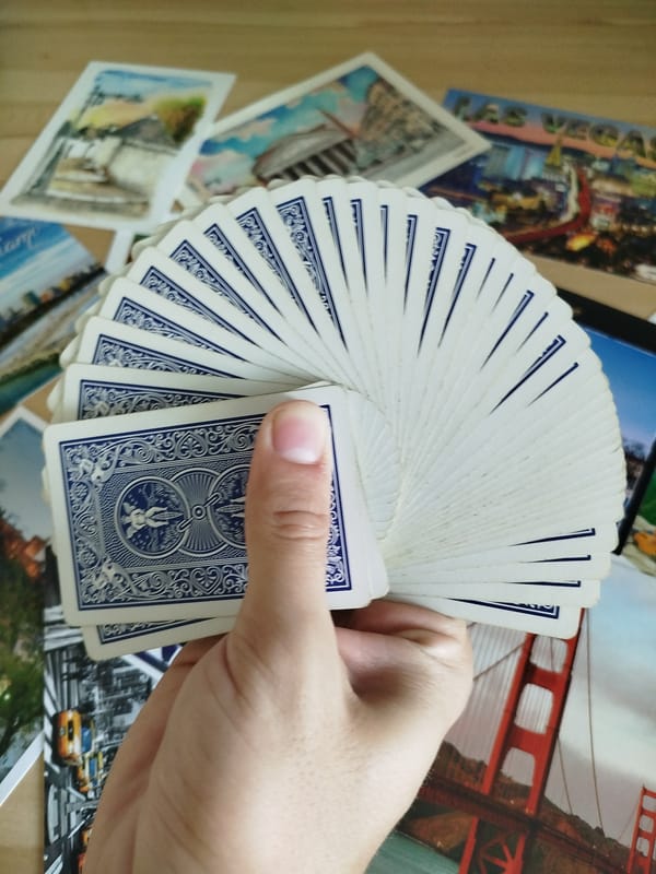 Travel postcards, souvenir magnets, and playing cards laid out in Varna