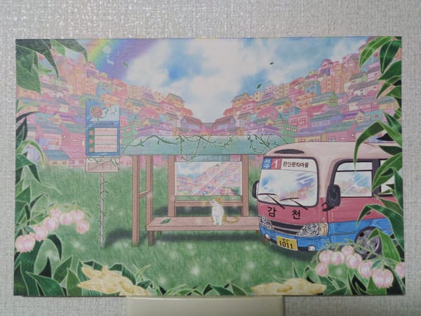 Witness documents postcard showing illustrated hillside town bus stop