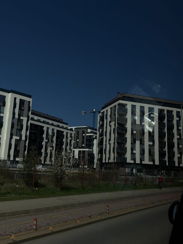 Modern apartment building photographed in Sofia, construction crane nearby